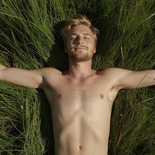 Sunlit Blonde Man in Tall Grass
