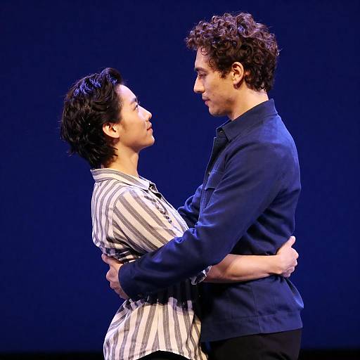 Dynamic Dance Duo Under Blue Lights