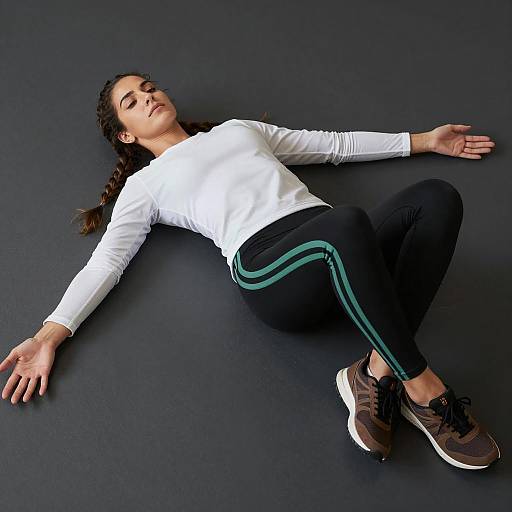 Intense Female Pose on Dark Floor