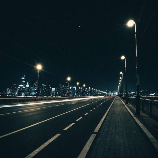 Nighttime Cityscape with Bridge and Streetlights