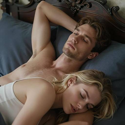Couple resting on bed with dark headboard