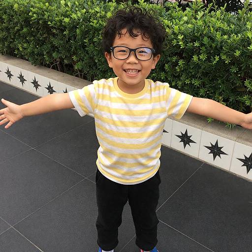 Smiling Asian Boy on Tiled Sidewalk