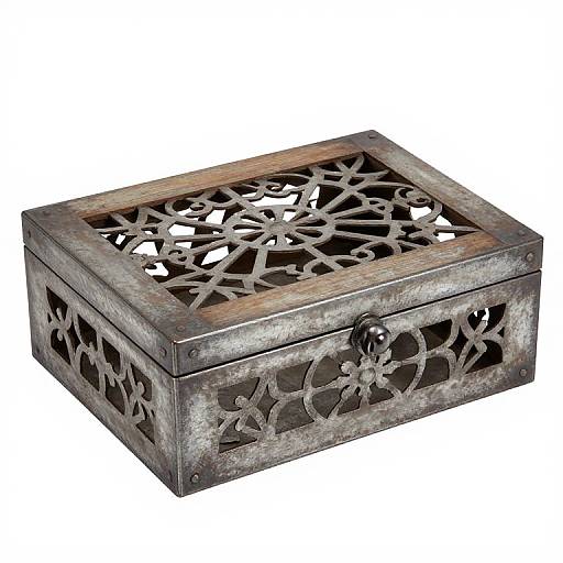 Rustic, rectangular metal box with intricate, lattice-patterned lid and sides, featuring a circular lock on the front. Photographic image.