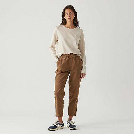 Woman in Casual Beige Shirt and Brown Pants