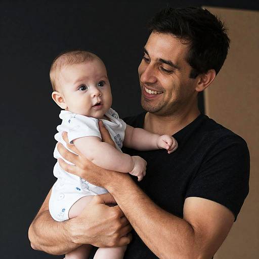 Joyful Moment: Man with Baby Portrait