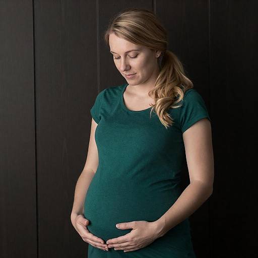 Blonde Pregnant Woman in Green Dress