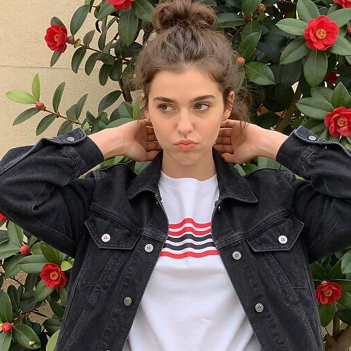 Young Woman Adjusting Jacket Outdoors