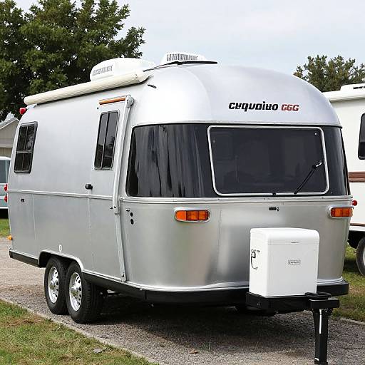 Photograph of a silver, retro-style, vintage travel trailer with 