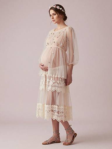 Serene Pregnant Woman in Ethereal Maternity Outfit