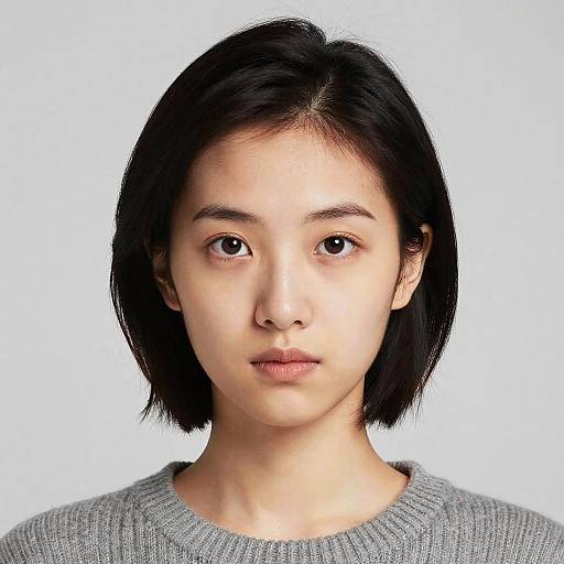 Portrait of Young Asian Woman in Gray Sweater