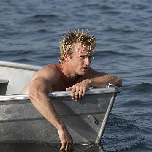 Concerned Man on Silver Boat by Water