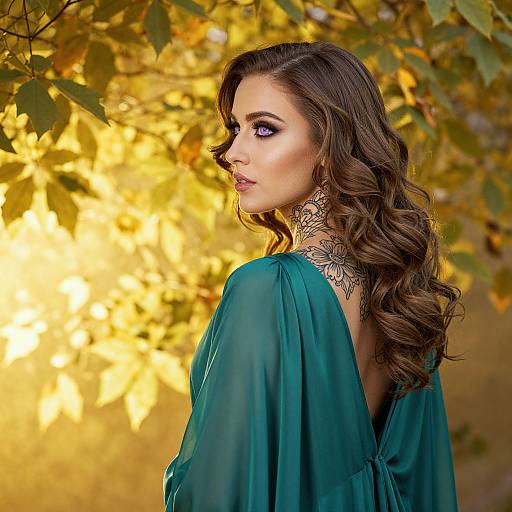 Photograph of a woman with long, wavy brown hair, wearing a teal, backless dress, showcasing intricate black lace choker, against a