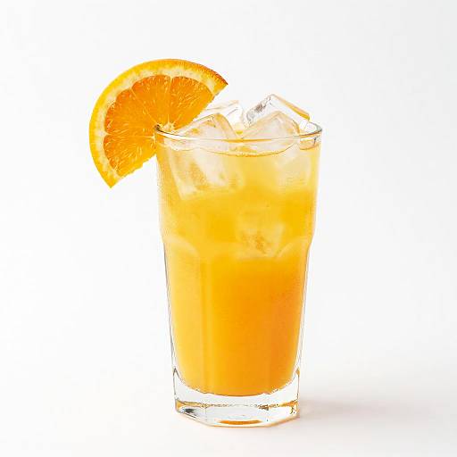 Photograph of a tall, clear glass filled with bright orange juice, garnished with a fresh orange slice, and ice cubes, against a white background