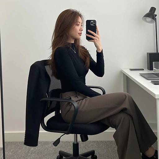 Woman Taking Selfie in Office Chair