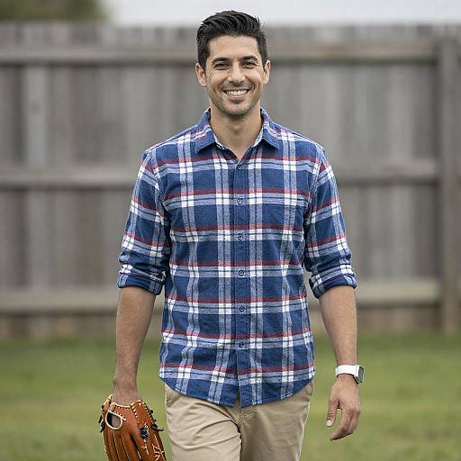 Smiling Man Wearing Plaid Shirt Outdoors
