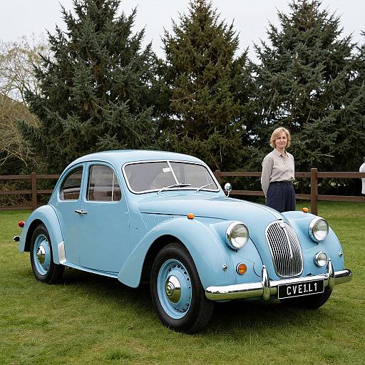 Photograph of a vintage light blue classic car with chrome accents and 