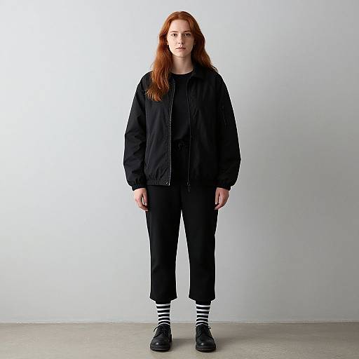 Woman with Red Hair in Black Outfit