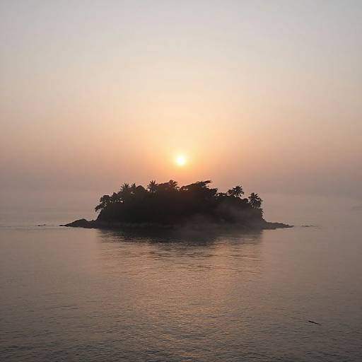 Photograph of a small, tree-covered island at sunset, with a glowing orange sun partially obscured by mist, reflecting on calm water.