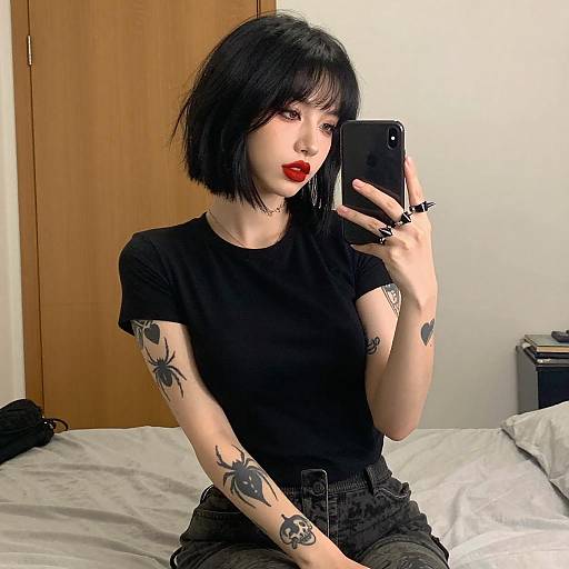 Tattooed Woman Taking Mirror Selfie