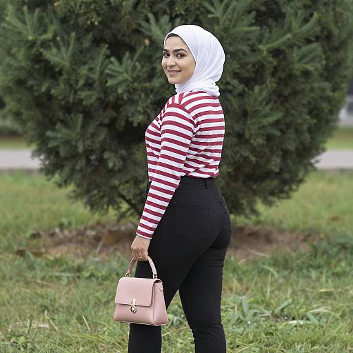 Smiling Woman in White Hijab Outdoors