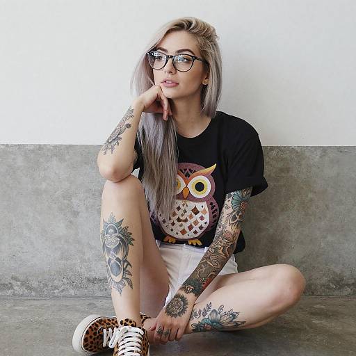 Young Woman with Tattoos and Owl T-Shirt