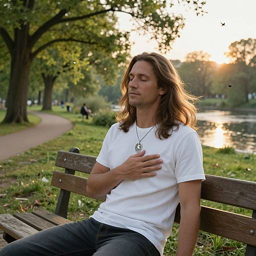 Serene Man Reflecting in Sunlit Park
