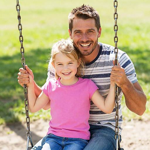 Joyful Father-Daughter Swing Moment