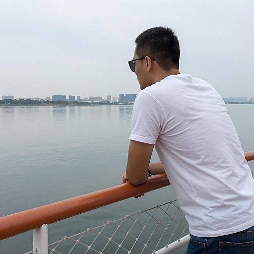 Man on Boat by City Skyline