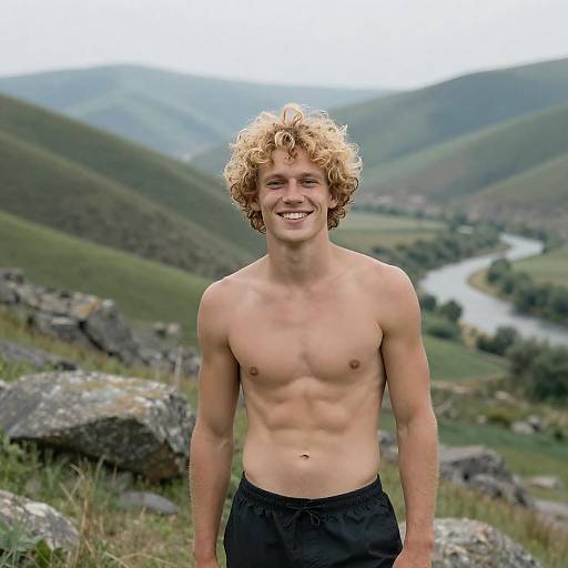 Smiling Shirtless Man in Mountain Landscape