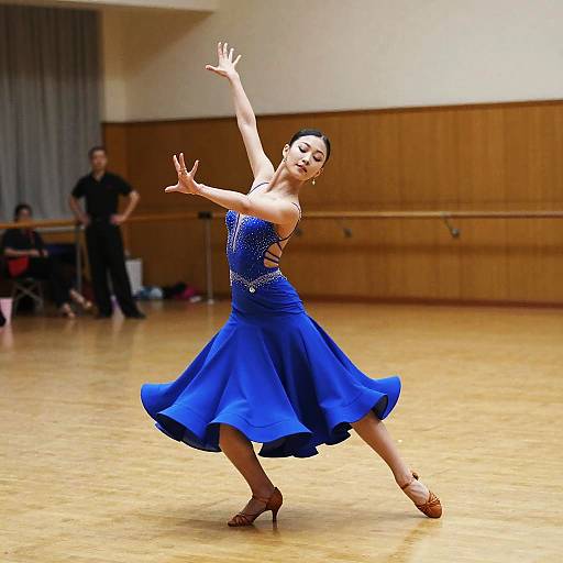 Woman Dancing in Blue Ballroom Dress