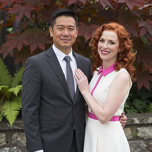 Couple standing outdoors smiling