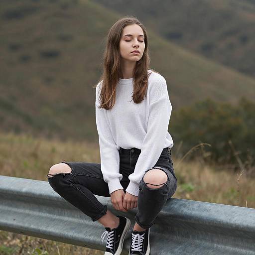 Contemplative Woman on Guardrail