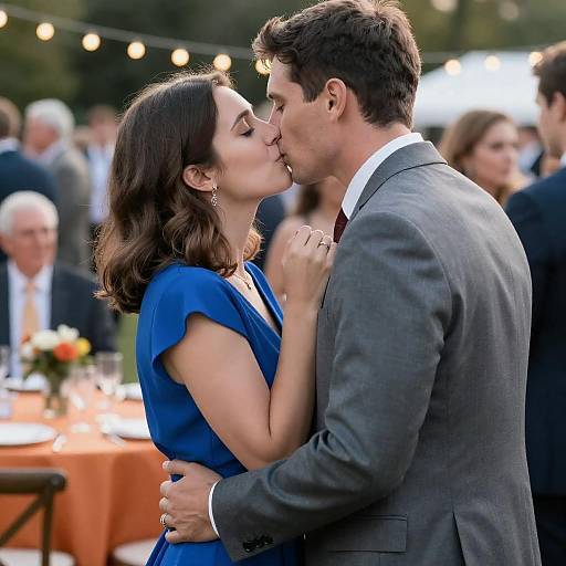 Romantic Kiss at Crowded Outdoor Event