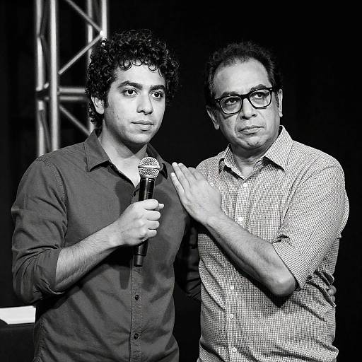 Black-and-White Photo of Two Men with Microphone