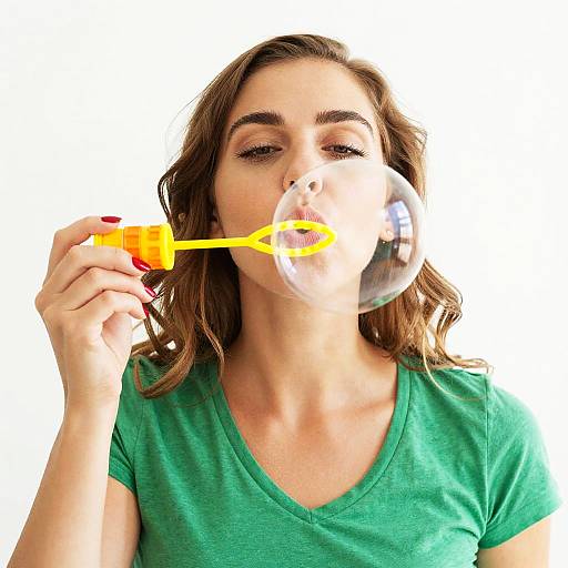 Young Woman Blowing Bubble with Wand