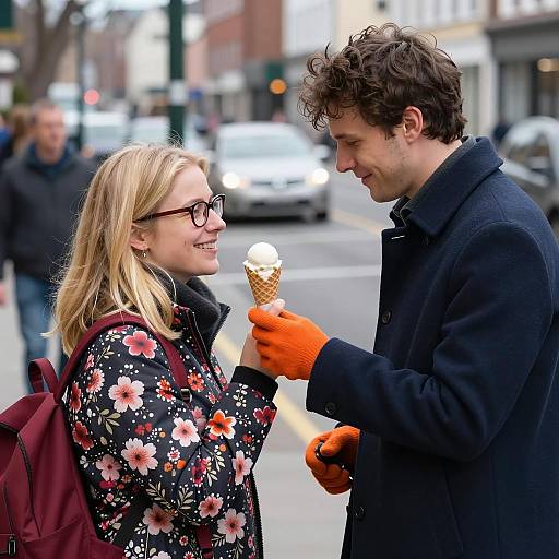Couple Sharing Ice Cream on City Street