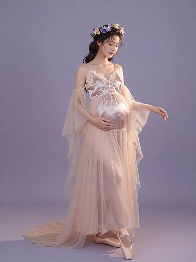 Pregnant woman in ethereal maternity gown
