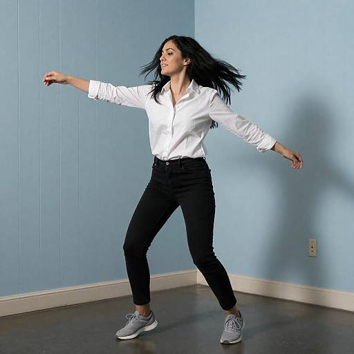 Energetic Woman Dancing in Blue Room