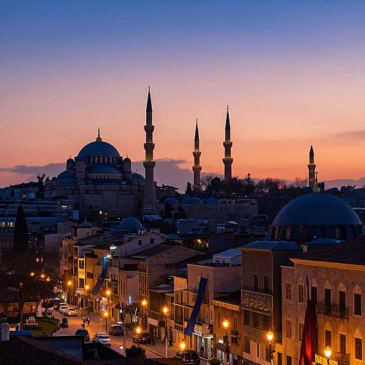 Photograph of Istanbul's skyline at dusk, featuring silhouetted domes and minarets against a vibrant orange and purple sunset sky, with