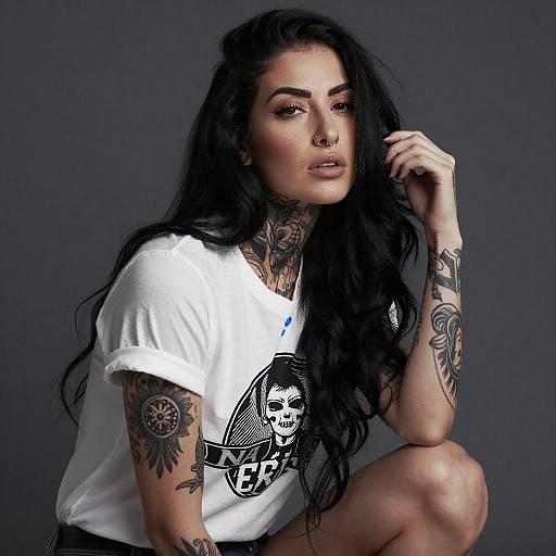 Tattooed Woman Posed Against Gray