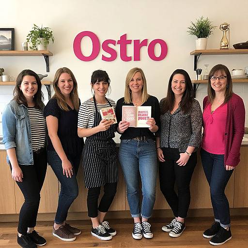 Photograph of six smiling women standing in front of an 