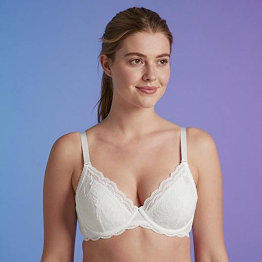 Woman in White Lace Bra on Gradient Background