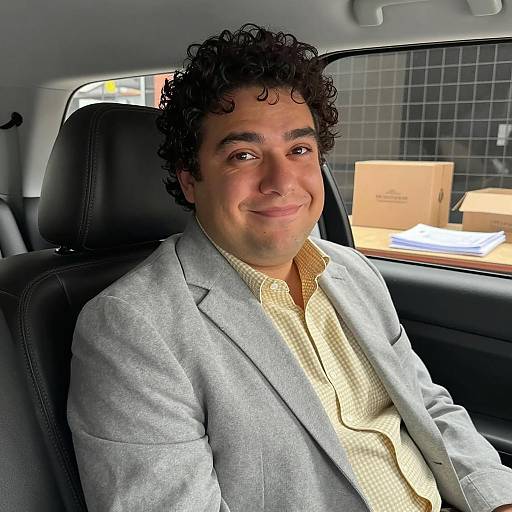 Portrait of a Smiling Man in Car