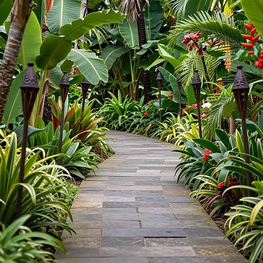 Stone Path Through Tropical Garden with Tiki Torches