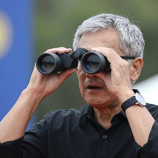 Older Man Using Binoculars Outdoors