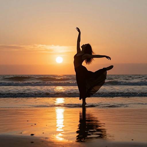 Silhouetted woman dancing on beach at sunset, arms raised, sun reflecting in wet sand, orange and gold sky, serene ocean waves. Photograph