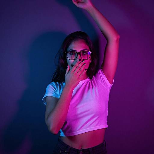 Neon-Lit Woman in Dramatic Pose