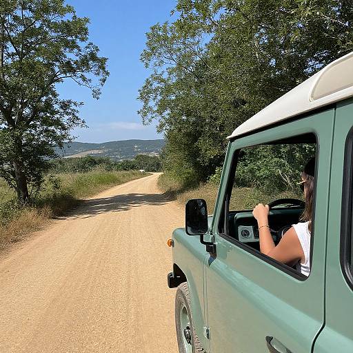 Woman Driving Vintage Green Vehicle