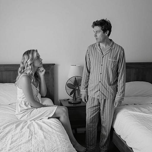 Intimate Bedroom Moment in Black and White