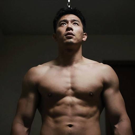 Striking Low-Angle Portrait of a Muscular Man